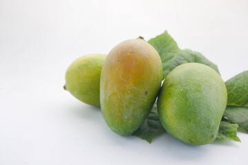 Fresh green mango on white background with copy space 