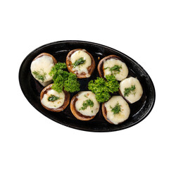 Isolated plate of baked mushrooms with cheese filling