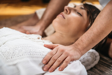 Obraz na płótnie Canvas Thai Healing Massage - Energy work between Practitioner and Client
