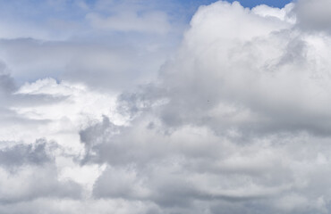 clouds float across the blue sky