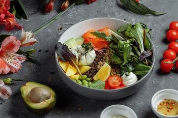 fresh healthy light breakfast, business lunch. Breakfast with poached egg, buckwheat, red fish, fresh salad, cucumbers, business lunch concept