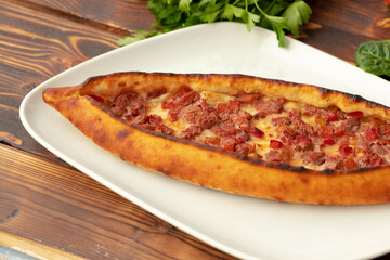 Close up of Turkish Pide bread on wooden table