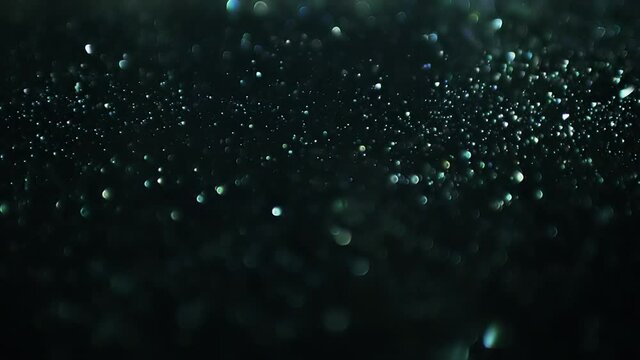 Cinematic background with green particles, Abstract motion of particles