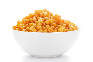 Close up of crunchy masala boondi Indian namkeen (snacks) on a ceramic white bowl.