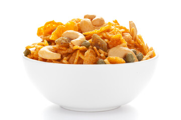 Close up of corn flex mixture Indian namkeen (snacks) on a ceramic white bowl.