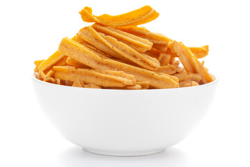 Close up of salted Soya Sticks Indian namkeen (snacks) on a ceramic white bowl.