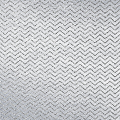 Silver leather background texture with glitter zig zag pattern. Sparkle material backdrop