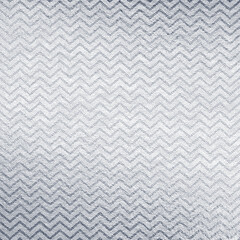 Silver leather background with zig zag pattern. Sparkle material backdrop. Shine paper