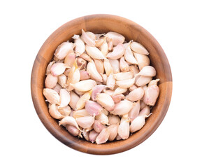 Garlic in a separate wooden bowl on white background