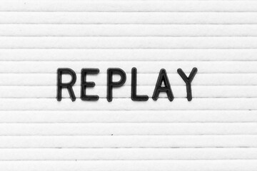 Black color letter in word replay on white felt board background