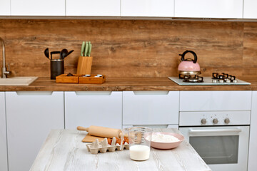 Fototapeta na wymiar interior of kitchen and dough ingredients