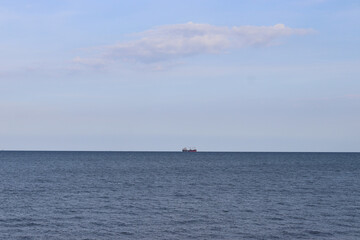 Natural scenery The calm blue sea A small boat in the middle of the sea And clear skies Beautiful clouds Cool wind Comfortable Relaxing, suitable for travel and vacation. Take photo in Thailand