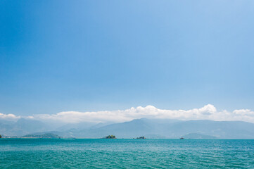 Coastline scenic view with blue sky and sea. Summer vacation day at Paraty's sea.