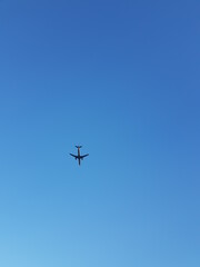 Take a picture of an airplane flying in the sky