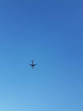 Take a picture of an airplane flying in the sky