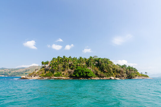 Coastline scenic view with blue sky and sea. Summer vacation day at Paraty's sea.