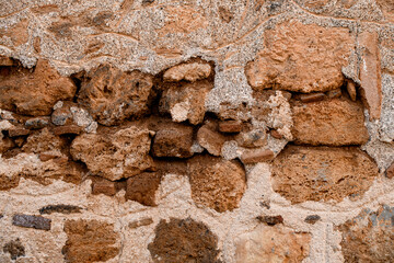 Close-up view of wall fragment with coarse shell rock masonry