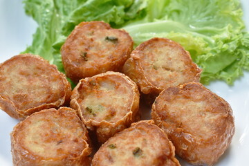 deep fried mashed crab meat and pork roll Chinese food on plate dipping sweet plum sauce