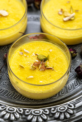 mango-flavored Phirni served in  glass bowls