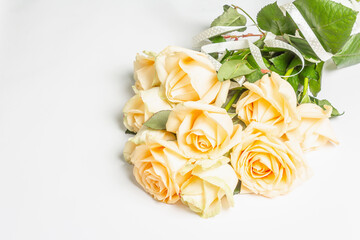 Delicate beige roses bouquet isolated on white background