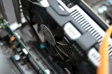 Dusty video card plugged into the motherboard in the camper.