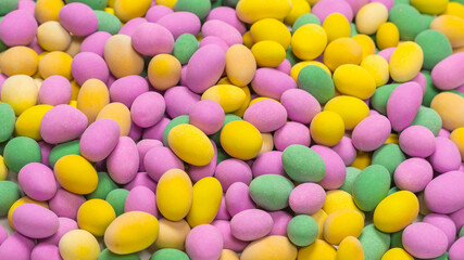Group of colorful peanuts in glaze.