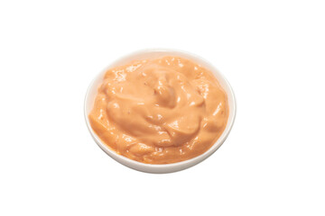 Sauce in a bowl isolated on white.