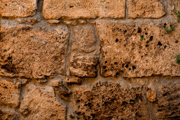 close-up of texture of stone block from shell rock. Beautiful smooth wall masonry