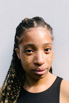 Portrait of girl with freckles and braids