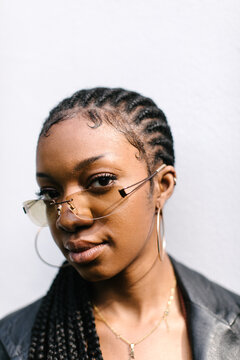Portrait of woman with sunglasses and braids