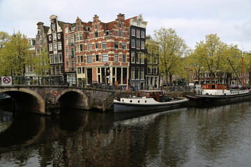 Fototapeta na wymiar One of the characteristic canals of the city of Amsterdam