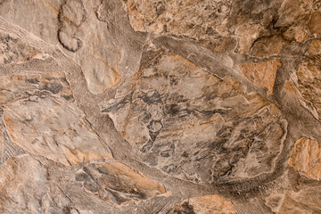 Close-up of cladding wall with natural stone of various shapes