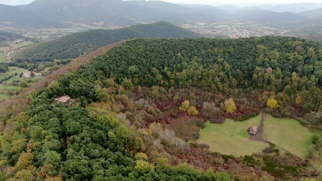 The Santa Margarida volcano with a hermitage in the centre of its crater. La Garrotxa Volcanic Zone Natural Park is a curious environment that overlooks part of the province of Girona.