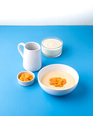 Mango yoghurt on blue background
