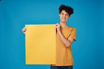 guy with curly hair yellow Poster mockup advertising blue background