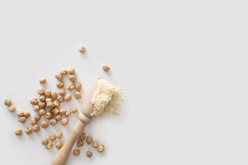 dry chickpea beans scattered on white background, top view, close-up, empty space for text