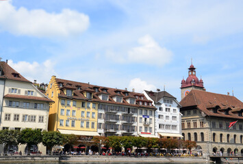 Naklejka na ściany i meble Hotels, restaurants and buildings on the side of Reuss river in Luzern, Switzerland