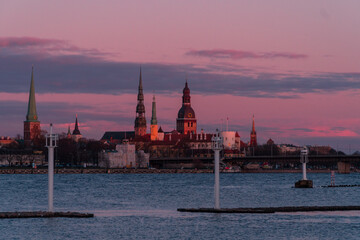 Fototapeta premium Early summer sunset European capital city. Colorful skies. Old town Riga, Latvia. 