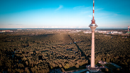 Aerial view of tv tower in Tallinn, Estonia. Forrest during the dusk and dawn.