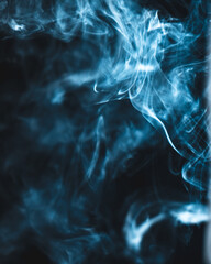 Blue smoke on black background isolated