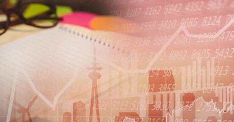 Composition of financial statistics processing and notepad in background
