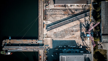 Aerial view of heavy industry manufacturing facility with cranes and bridges