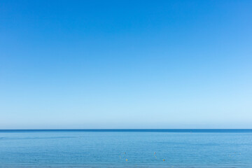 Fototapeta premium Blue sky and sea. Praia da Rocha sea, Portimão, Algarve, Portugal
