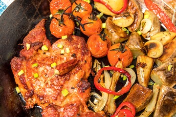 Meat, Pork neck in marinade and on a steel pan. Pork neck with baked potatoes and vegetables with chili.