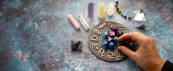 zodiac horoscope symbol with fortune-teller hands and healing crystals on rustic background - obrazy, fototapety, plakaty