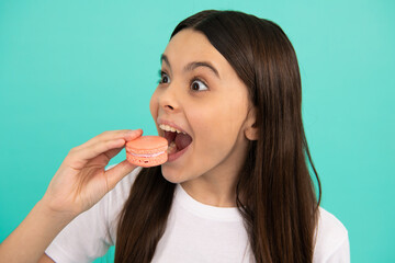 amazed child eat french macaron or macaroon cookies, sweet tooth