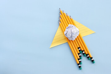 Back to school or education concept. rocket made from pencils over blue background