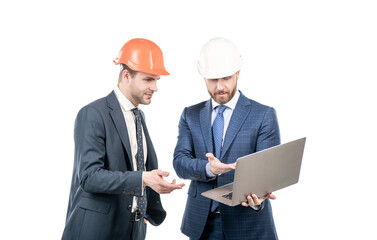 architects planning work. chief engineer and executive in hardhat use computer.