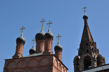 Domes of the cathedral and the top of the bell tower against the sky. Krutitskoe courtyard, Moscow