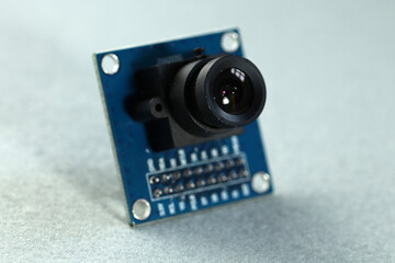 Electronic components. Small video camera for embedding on electronic projects. Close up. - obrazy, fototapety, plakaty